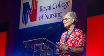 Retired member speaking at a conference