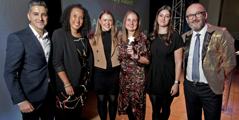 Alcohol Care Sheffield Group of smartly dressed people celebrating winning an award