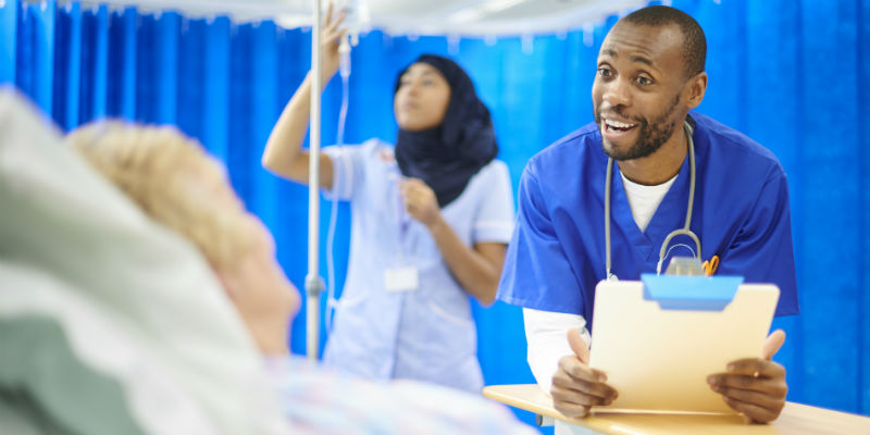 male nursing smiling with patient