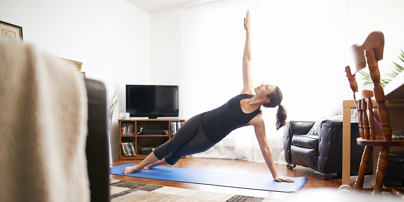 Women doing yoga at home
