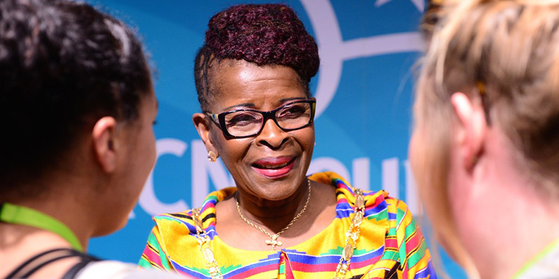RCN president Cecilia Anim smiles at two delegates at Congress 2017