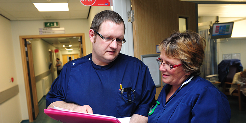 Nurses looking at a patient file