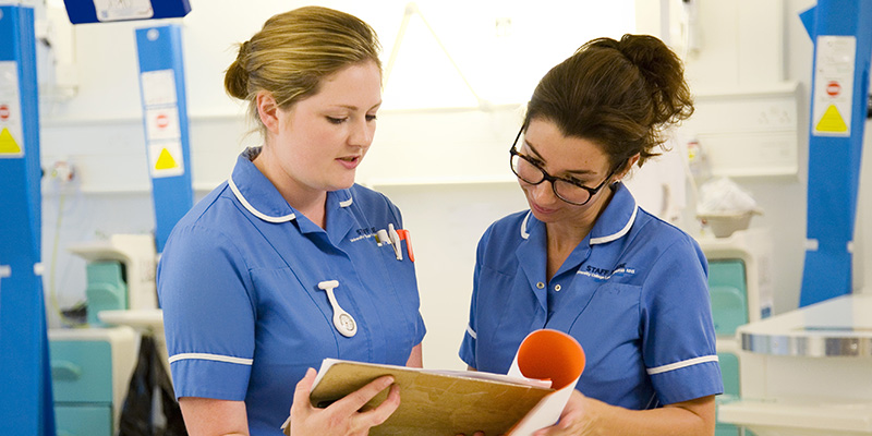 Two nurses talking to each other