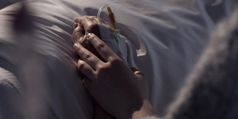 Nurse holding sick patient