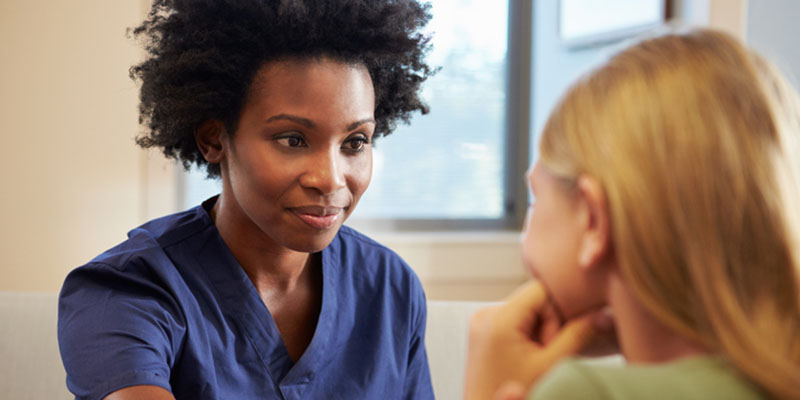 Mental health nurse with patient