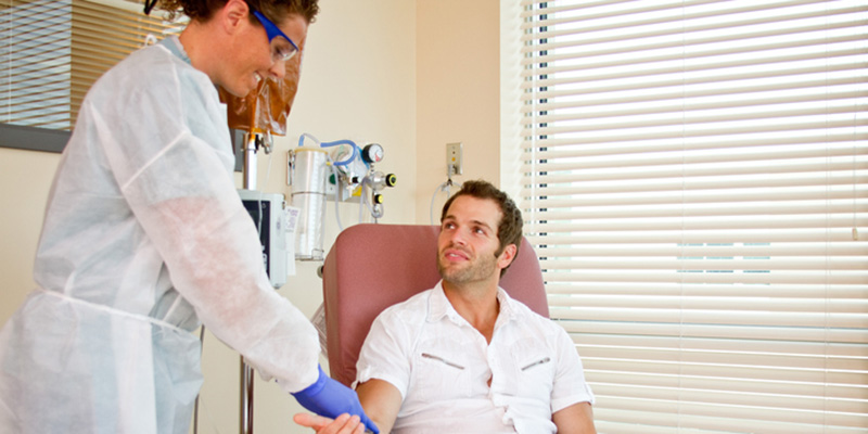 Nurse with male cancer patient