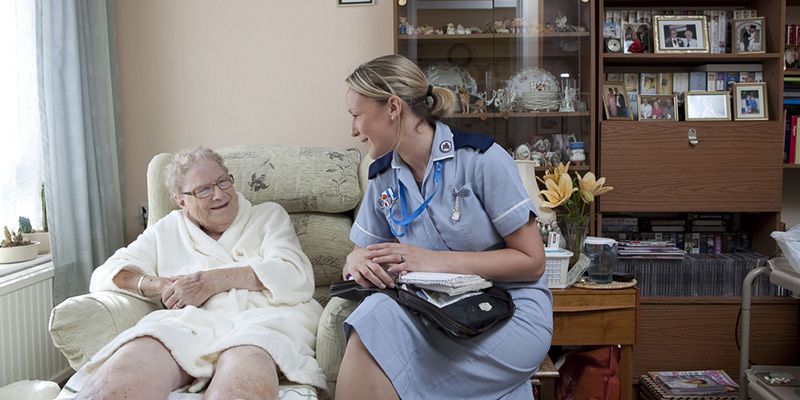 District nurse in patient