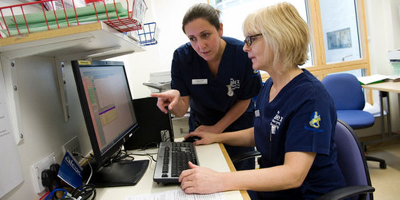Busy nurses at a computer