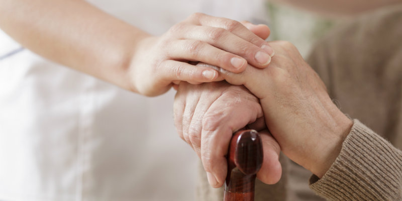 Nurse helping elderly patient