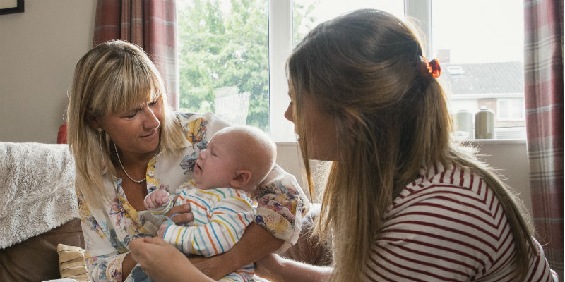 health visitor with mother and baby