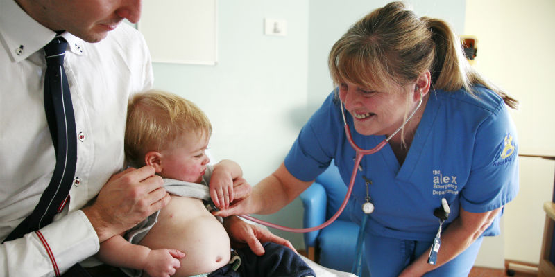 nurse and child smiling
