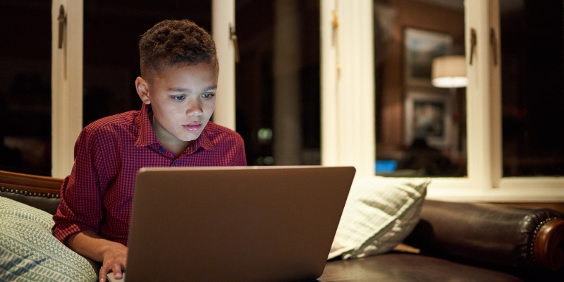 Boy looking at laptop screen