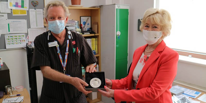 Geoffrey Walker receiving an award from Dame Yvonne Moores on behalf of the Florence Nightingale Foundation Geoffrey Walker receiving an award from Dame Yvonne Moores on behalf of the Florence Nightingale Foundation