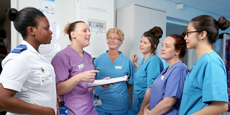 Nursing staff gather for daily briefing