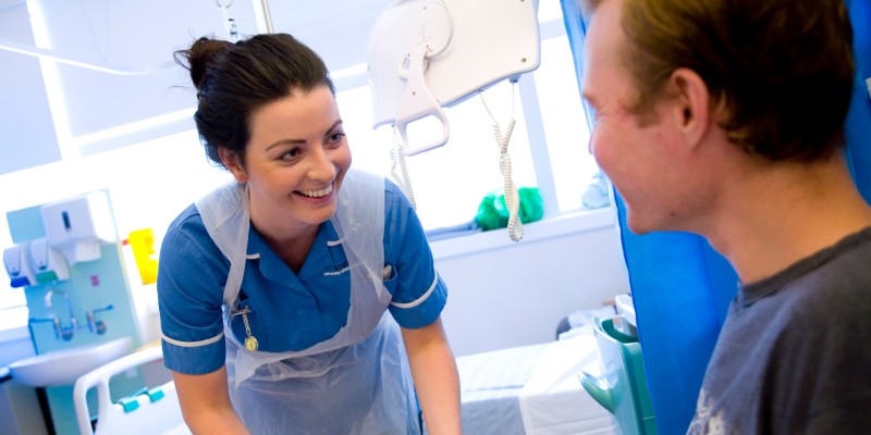 Nurse smiling with patient