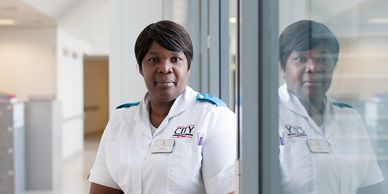 A trainee nursing associate in a hospital setting