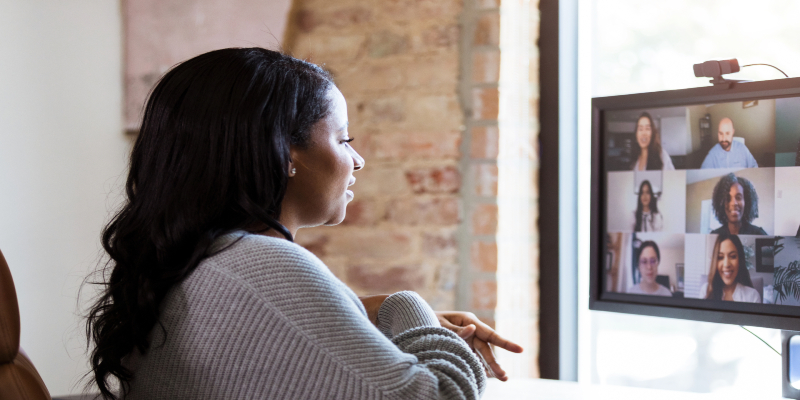 woman watching virtual conference