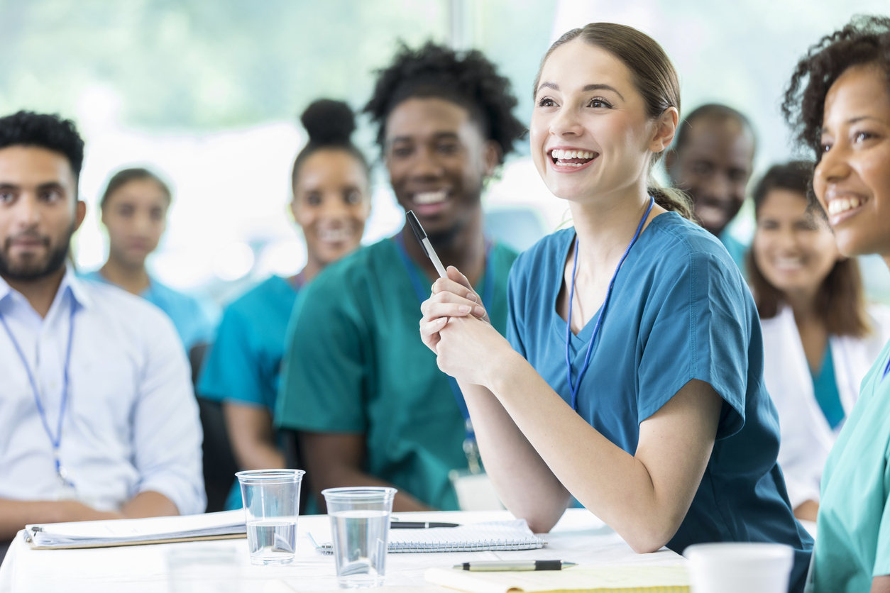student nurse with pen