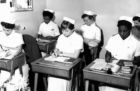 Student Nurses at their desks c.1950 @Model.StoryImage.Alt