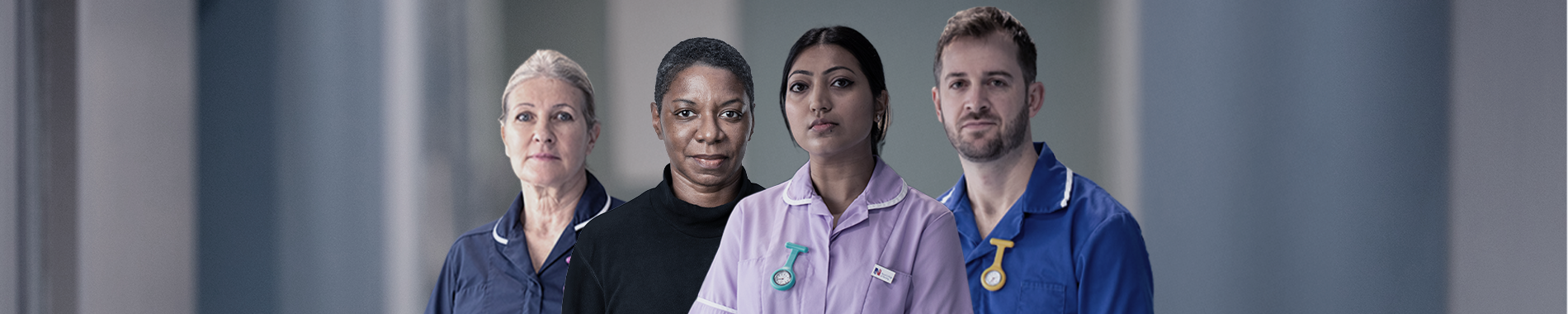 Four nurses standing next to one another