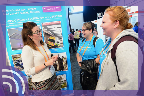 RCn members talking with an Exhibitor at congress