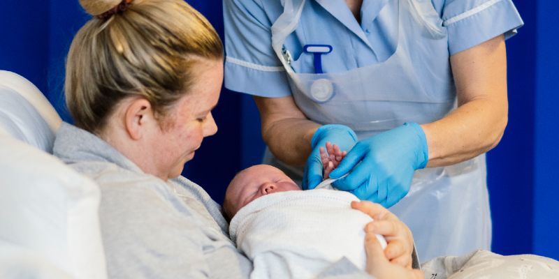 Mother holding anew born baby