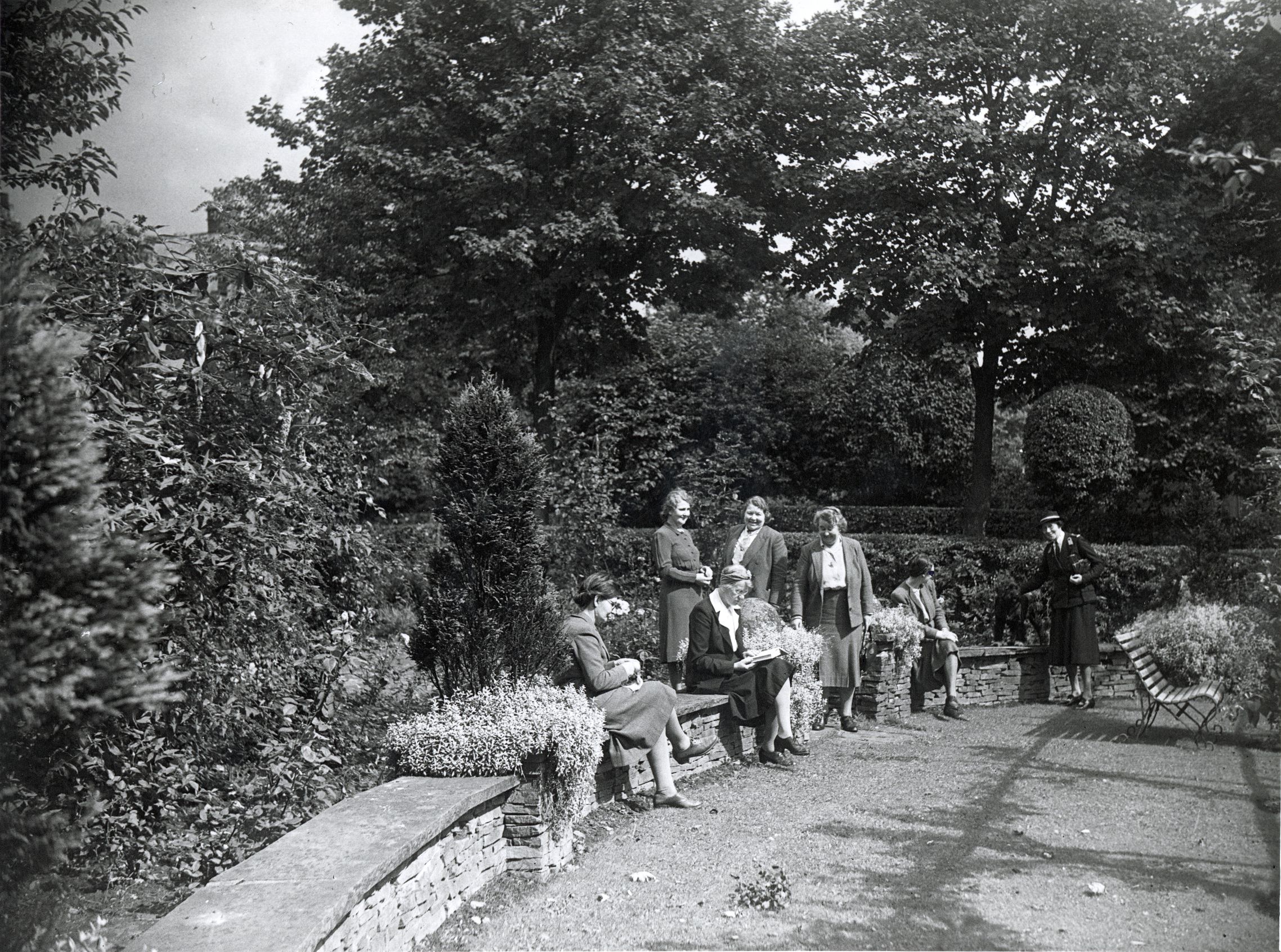 Nurses gathered on a wall at Barton-on-sea rest home