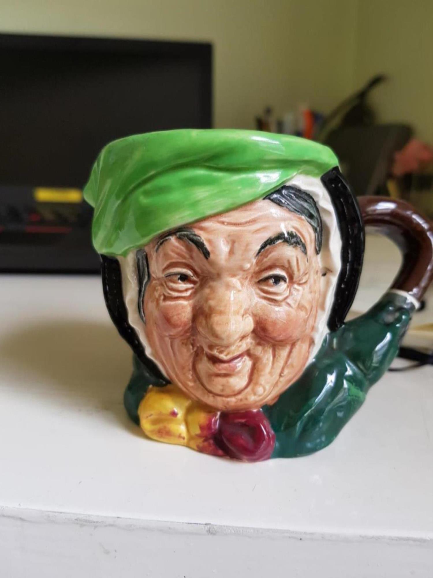 Sairey Gamp character Toby Jug by Royal Doulton, the umbrella makes up the handle. First manufactured in the 1930s. On loan from Sarah Cull. 