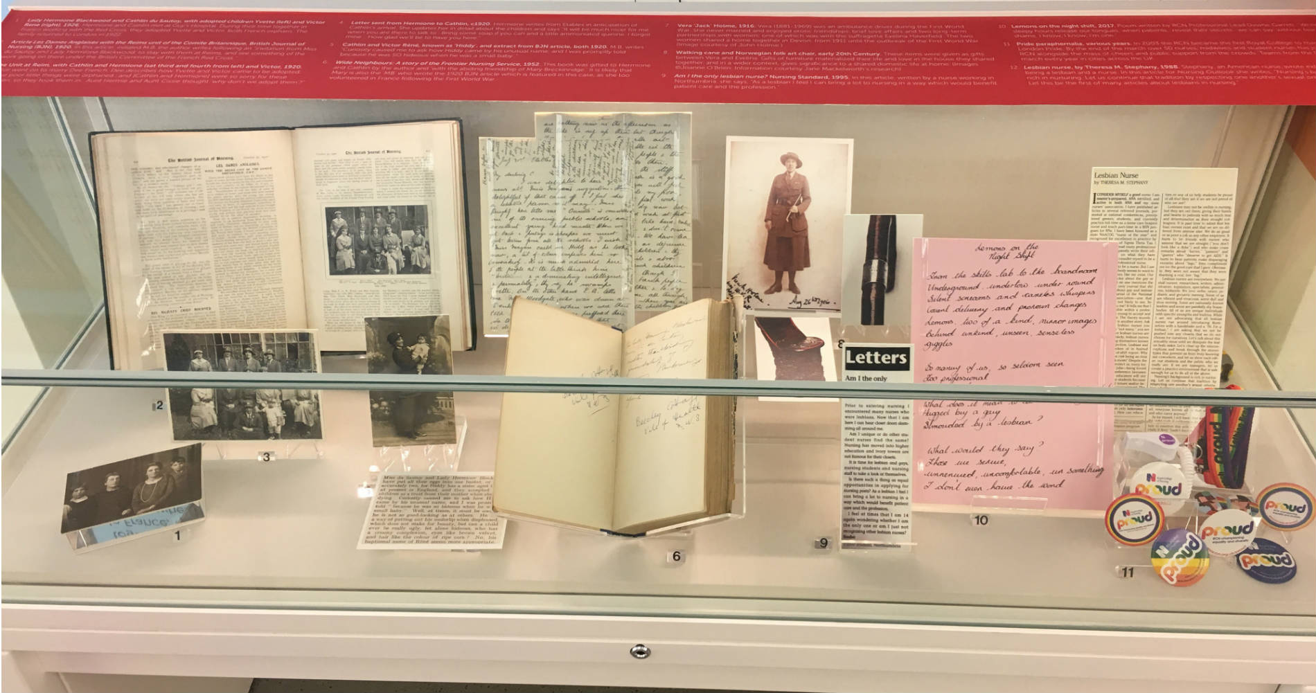 A display case showing items of the LGBTQ+ expereince of nursing