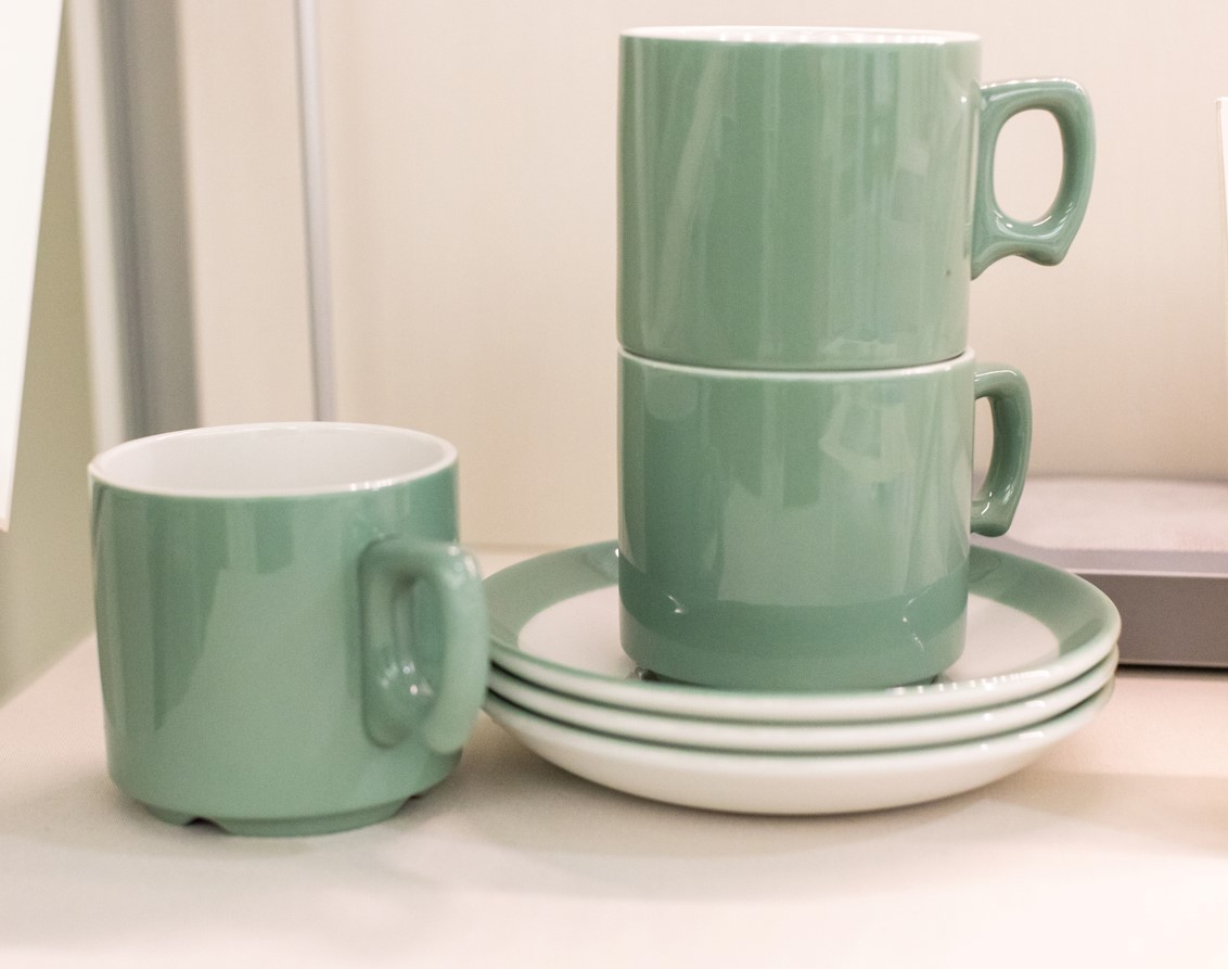 Set of 3 light green cups and saucers, stacked on top of each other