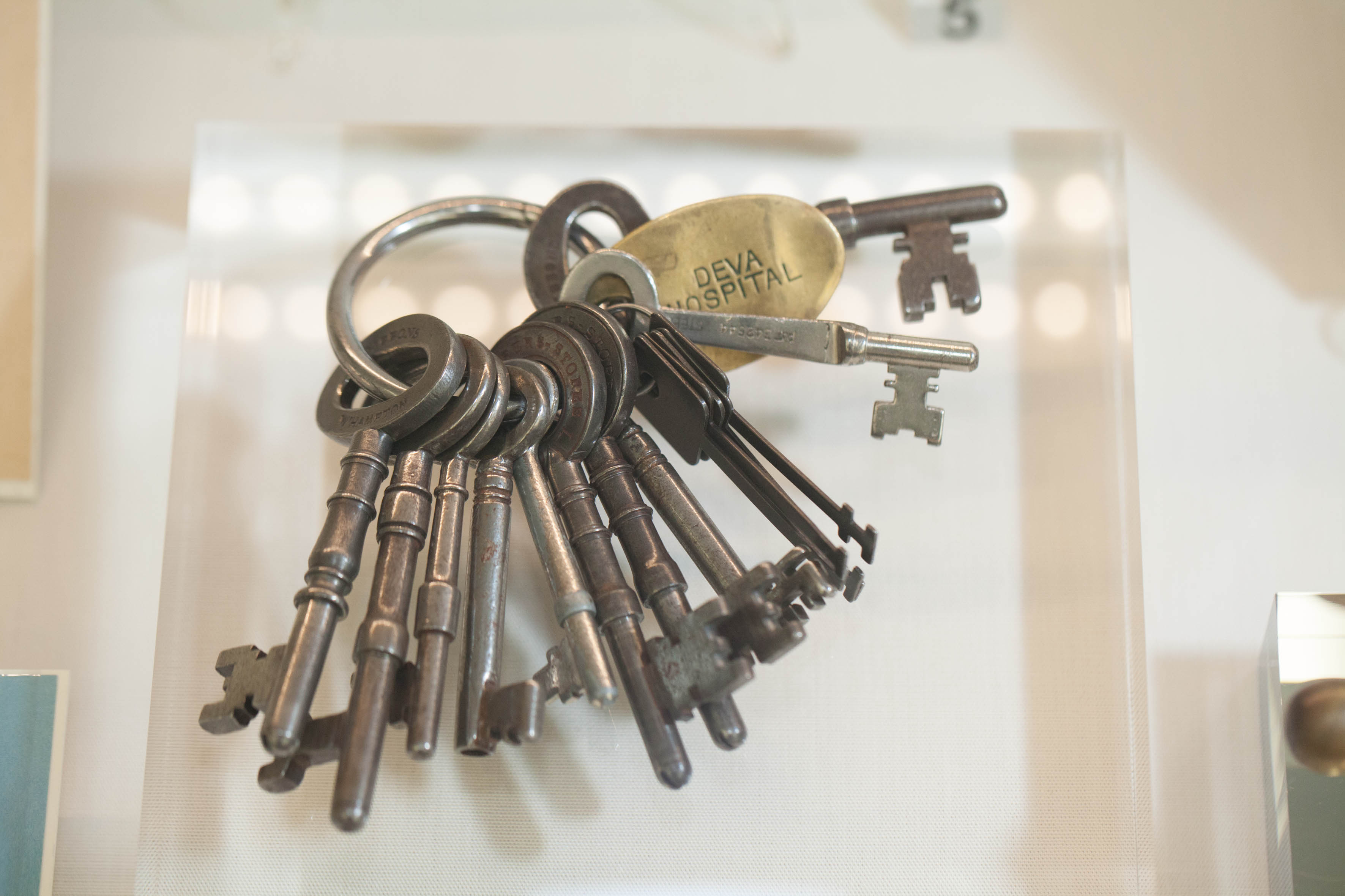 A selection of old fashioned keys on a keyring.