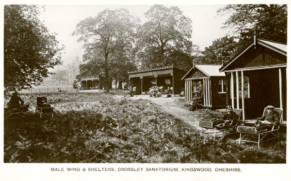 Postcard of view of the male wing of Crossley Sanatorium, Kingswood, along with shelters for sitting outdoors. Men are seated outside under trees, outside shelters, and inside shelters, 1910. RCN Archive.