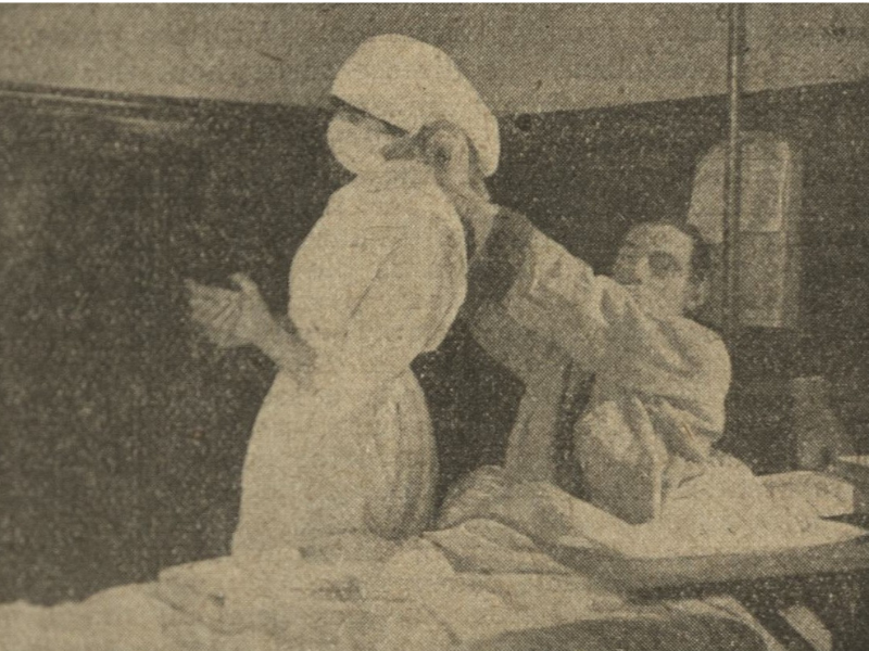 historical image of nurse having their mask fastened
