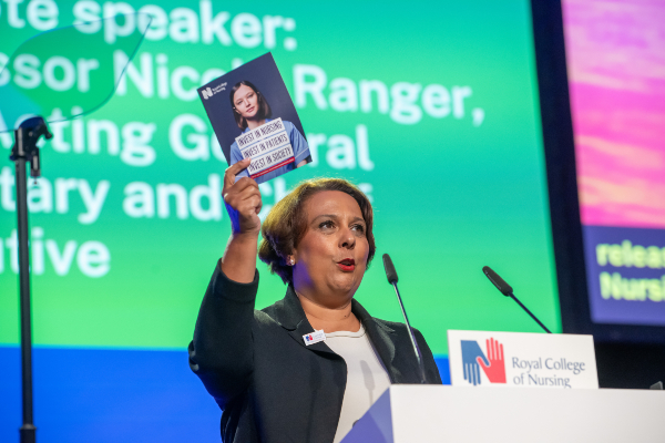 RCN nursing union leader Nicola Ranger holding RCN manifesto at Congress 2024