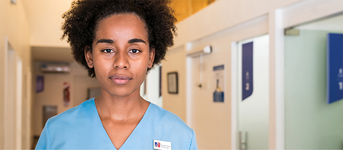 female nurse in hospital corridor