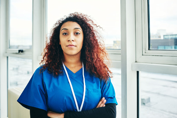 Image of nurse with her arms folded
