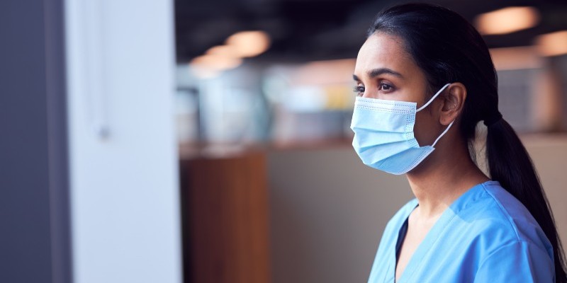 Member of nursing staff wearing a mask