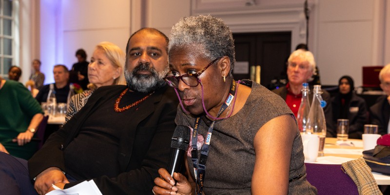 RCN member holds microphone and asks question to Secretary of State for Health and Social Care Victoria Atkinsvat London HQ on 10 April 2024