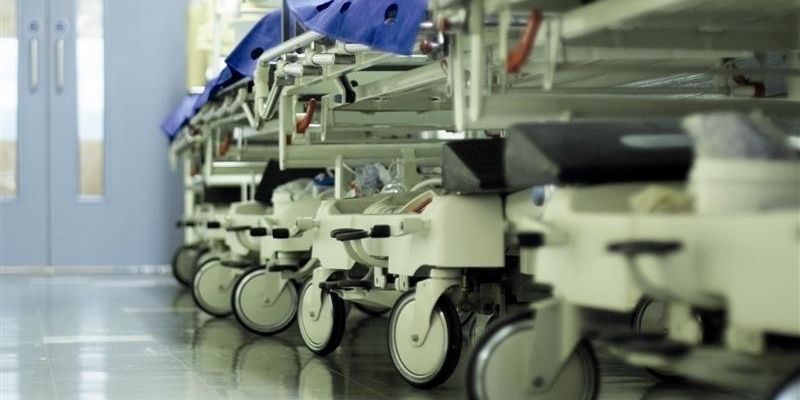 A row of trolleys in a hospital corridor