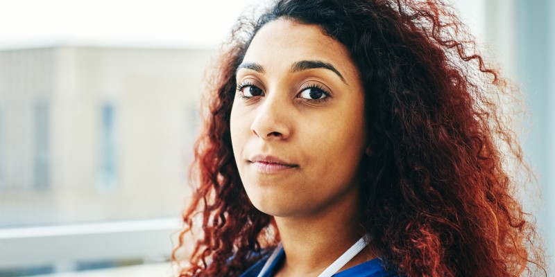 A member of nursing staff looking defiantly at the camera
