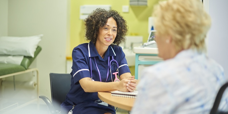 GP nurse talking to patient