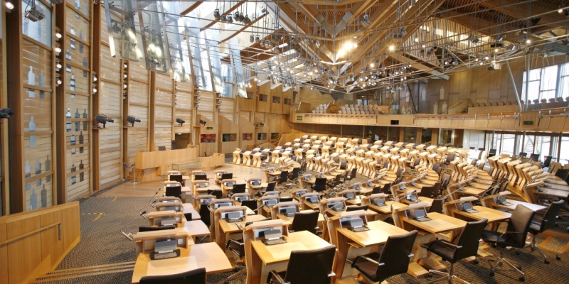 Photo of an empty Scottish Parliament debating chamber