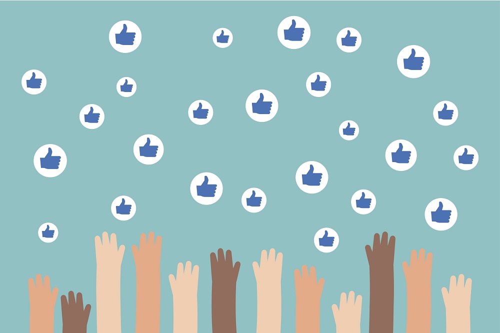 Graphic of hands reaching up to touch Facebook likes.