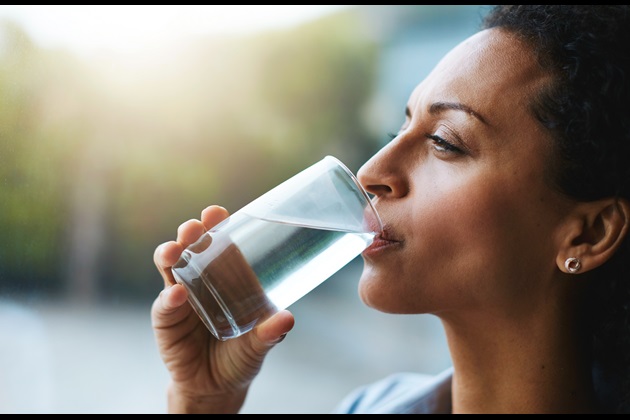 Rest, rehydrate and refuel woman drinking water