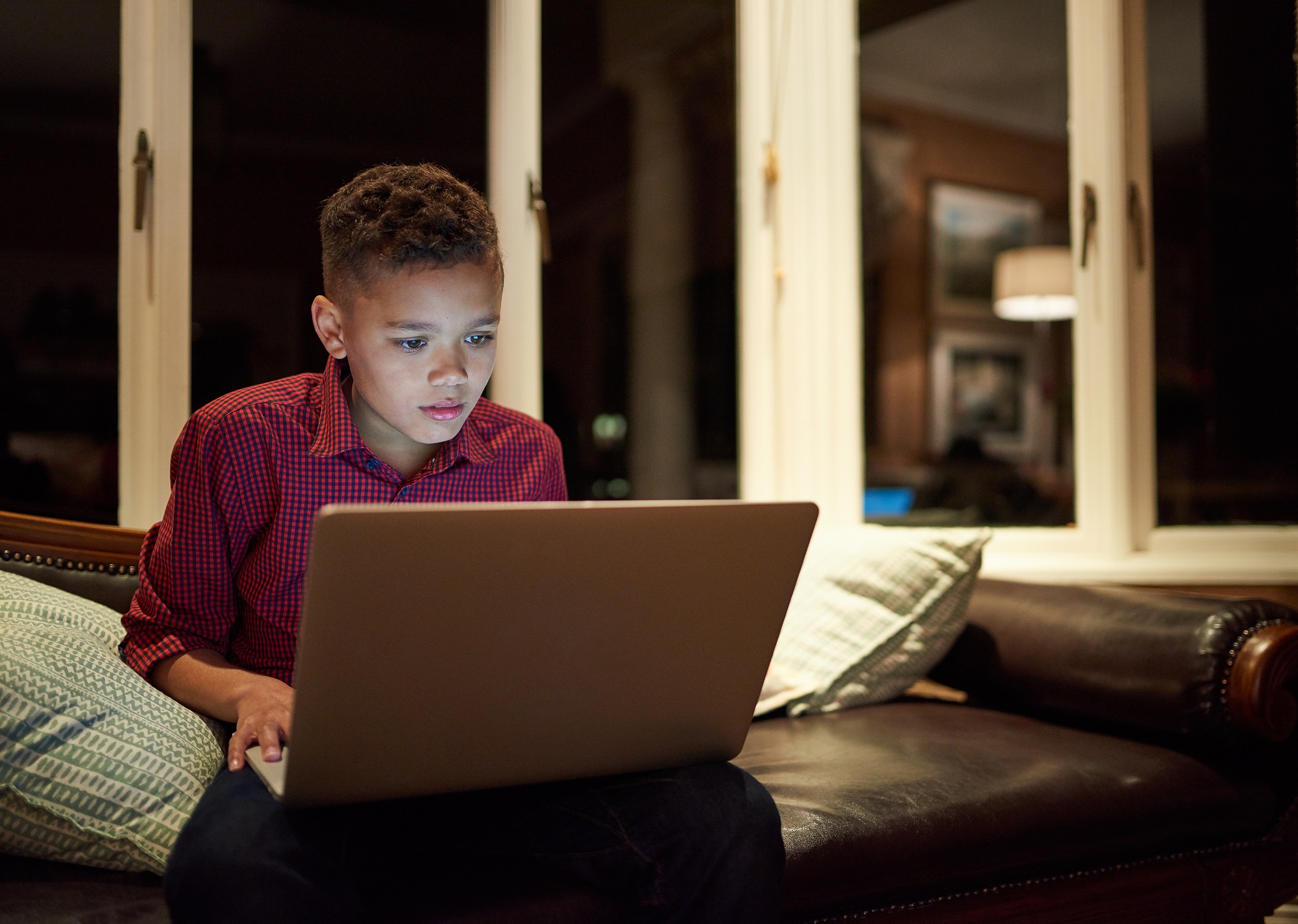boy looking at laptop