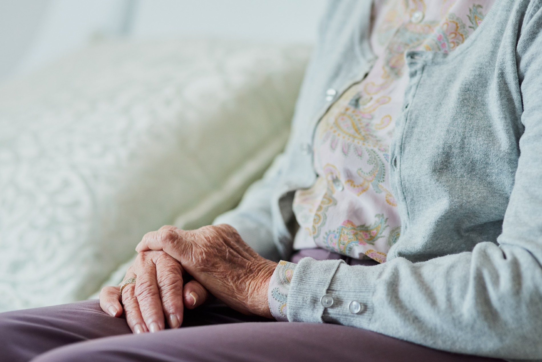 Elderly woman sitting alone
