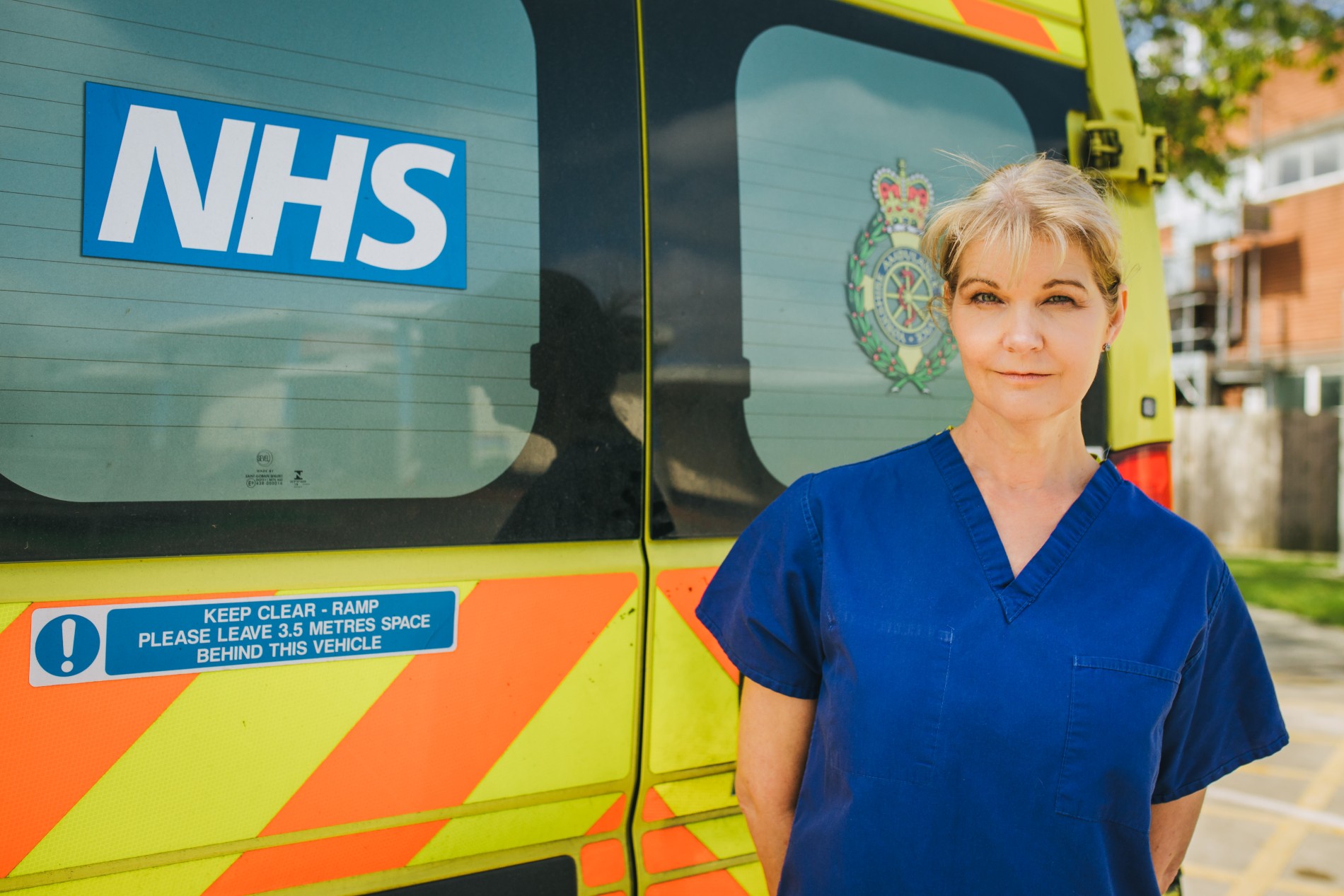 Dawn Bilbrough in front of an ambulance