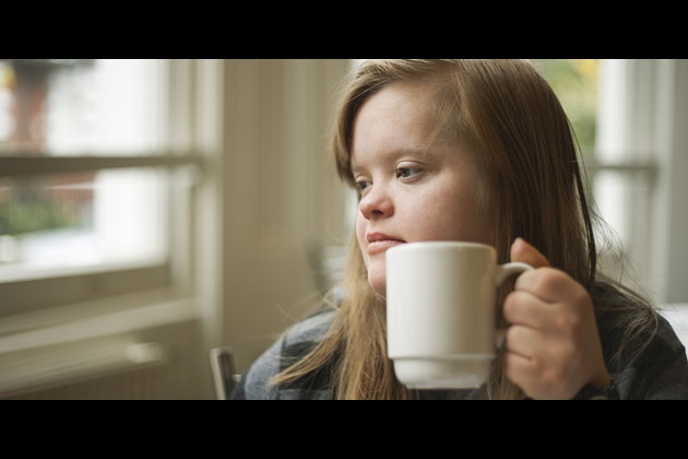Girl drinking mug of tea