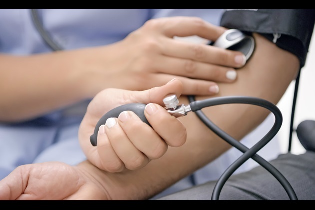 Nursing associate taking blood pressure