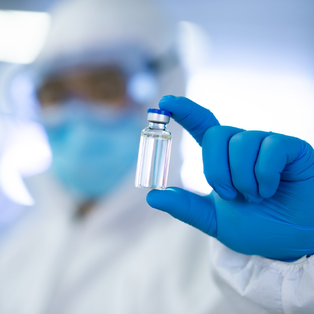 Lab technician with medical vial